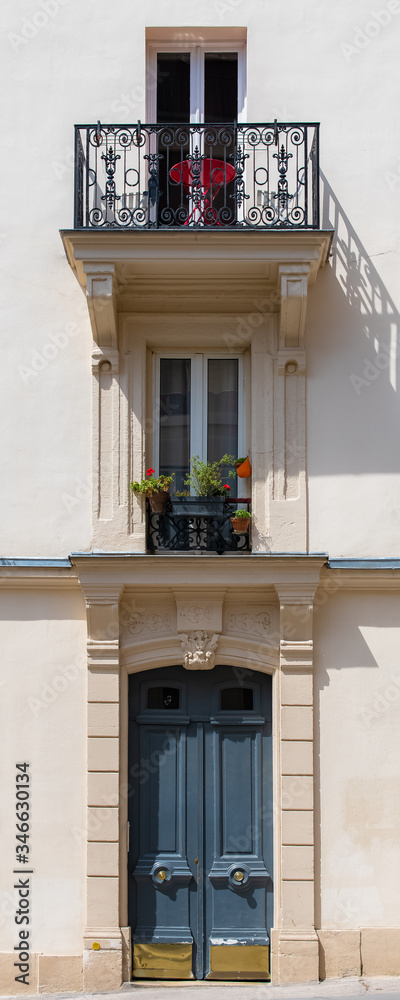 Paris, an ancient door, typical windows, beautiful house in Montmartre
