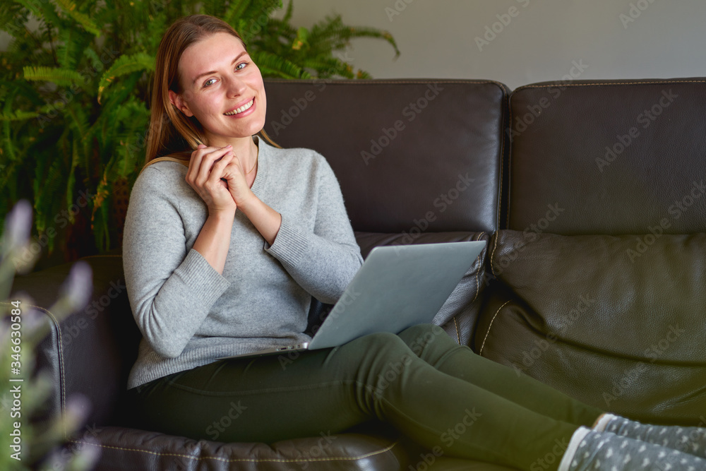 young beautiful woman using a laptop computer at home young beautiful woman using a laptop computer at home