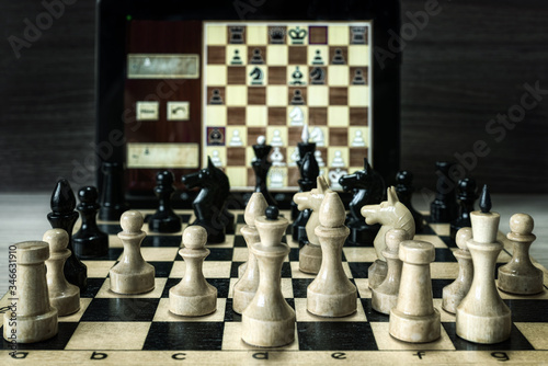 Obraz na płótnie Playing chess with a computer, selective focus.