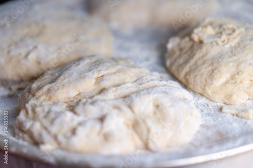 Flour dough sprinkled on a tray