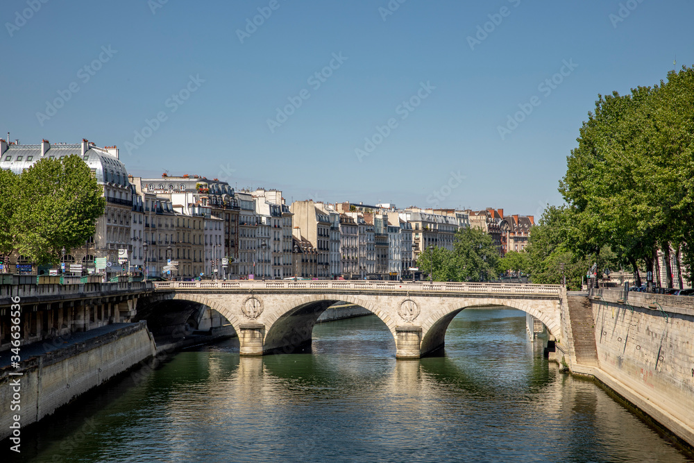 Paris, France - May 6, 2020: Typical Haussmann buildings in the left Seine river side in Paris. There is nobody in the street due to lockdown because of covid-19
