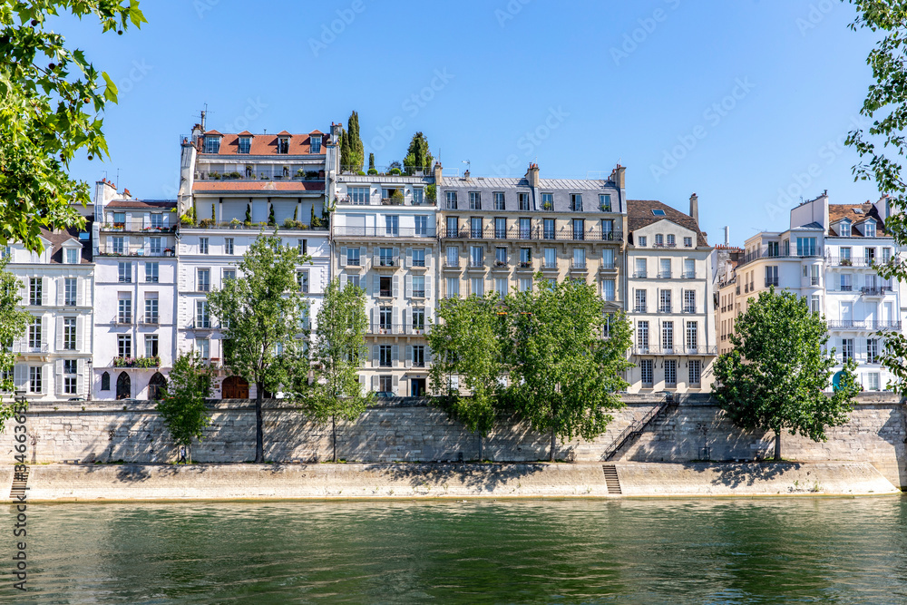 Paris, France - May 6, 2020: Typical Haussmann buildings along the Seine river in Paris
