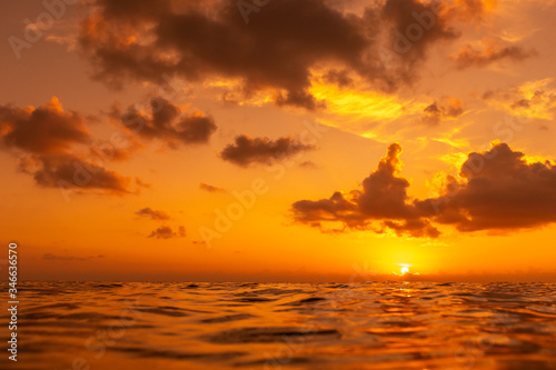 Fototapeta Naklejka Na Ścianę i Meble -  Colorful sunset over ocean surface.