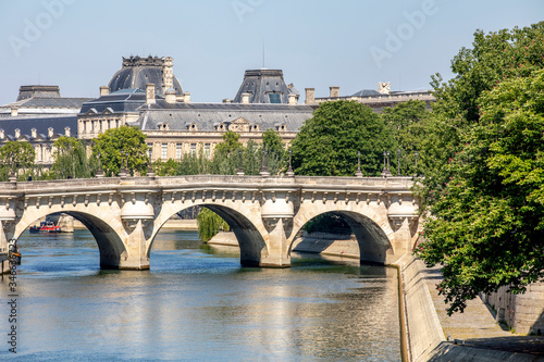 Paris, France - May 6, 2020: View of the Pont Neuf, bridge over the Seine in Paris and buildings along the river