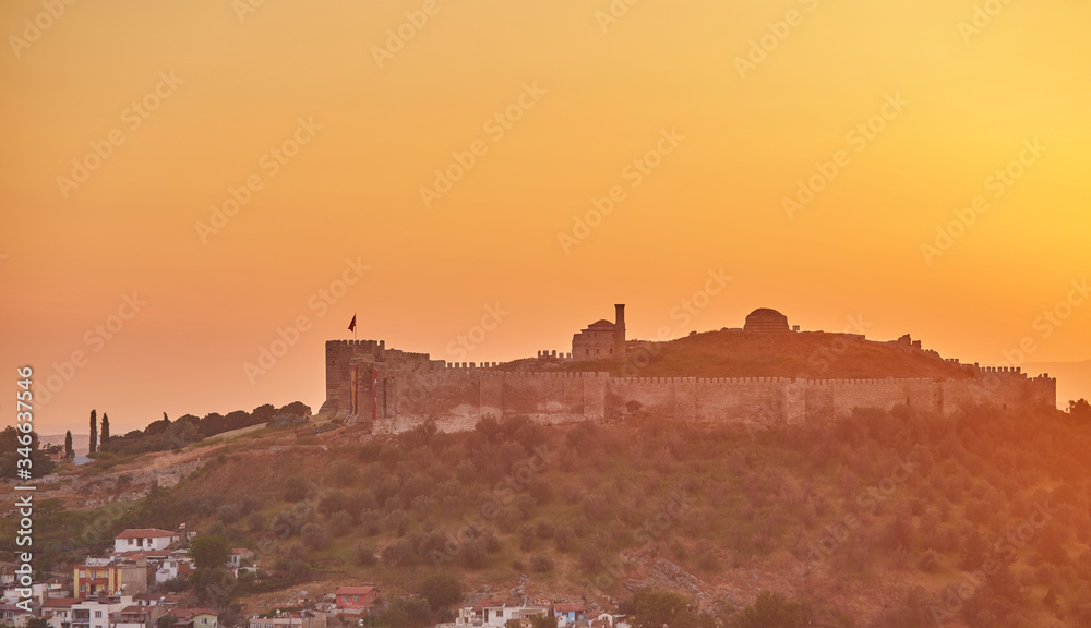 View of Selcuk with Ayasuluk fortress during sunset in the evening