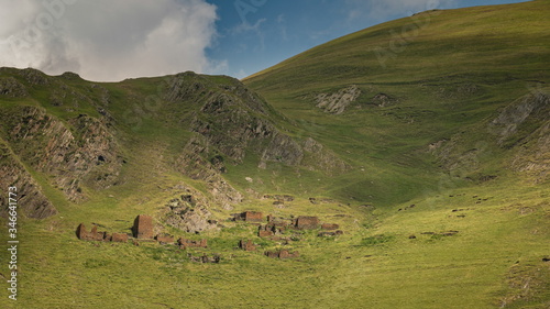 The stone ruins of acient georgian village, wich you can see in Caucaus in Georgia on Omalo Shatili trek. photo
