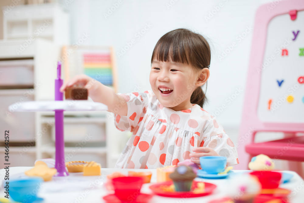 toddler girl prerend play preparing tea party at home toddler girl prerend play preparing tea party at home