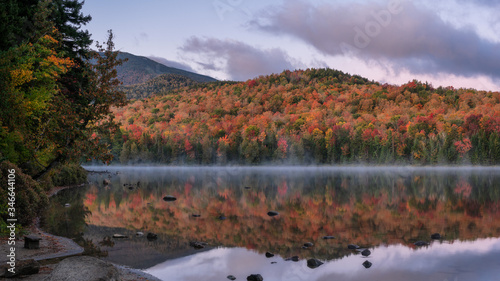 Autumn view of Saco Lake at the AMC Highland Center in the White Mountain national forest