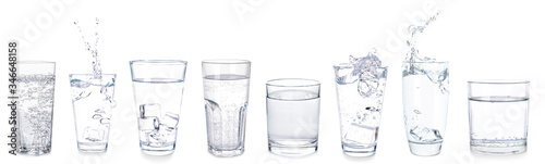 Many glasses of fresh water on white background