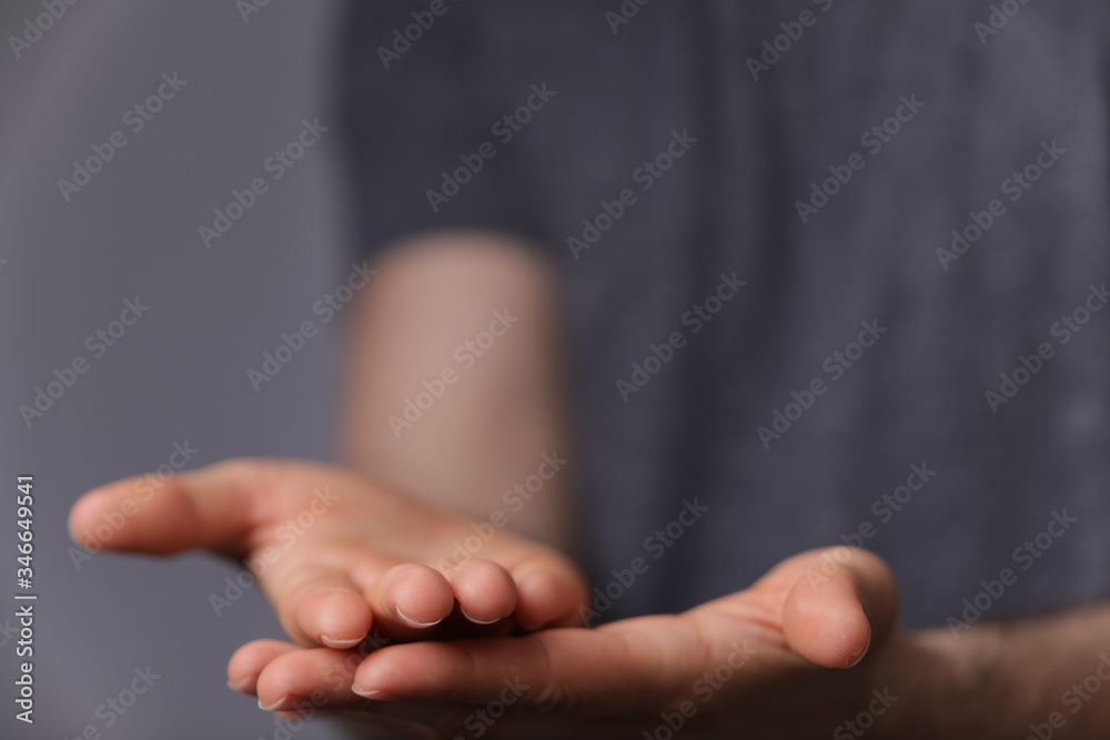A man without head holding something without theme. A man without head holding something without theme.