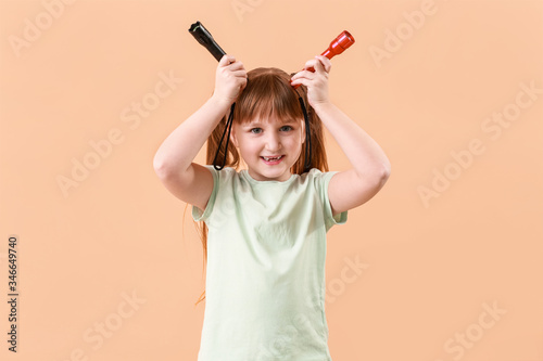 Little girl with flashlight...