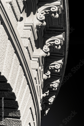 Detail of corbel in black and white image. Abstract architectural picture on a black background.