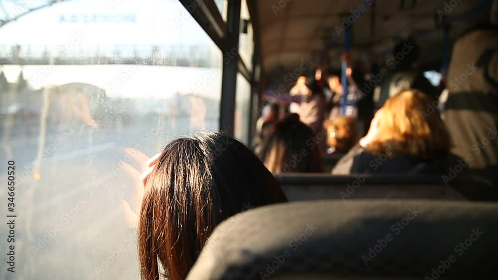 People in old public bus, view from inside the bus . People sitting on a comfortable bus in Selective focus and blurred background. the main mass transit passengers in the bus.