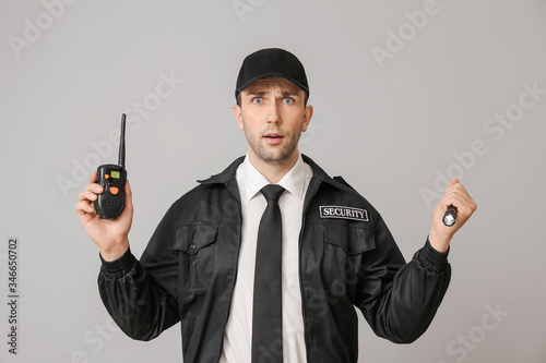 Male security guard with fl...