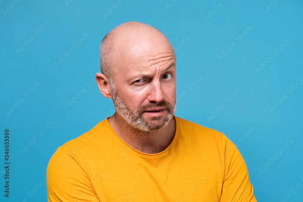 mature man looking with mistrust does not believe in news mature man looking with mistrust does not believe in news