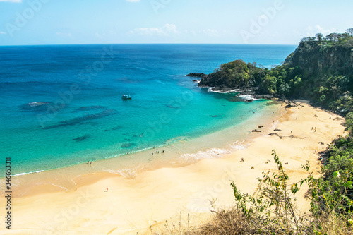 Panoramic view of Sancho Beach and Sancho bay, Fernando de Noronha Island, Brazil. Natural beach with trees and plants around © Jair