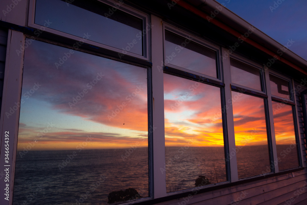 sunset over the sea
window