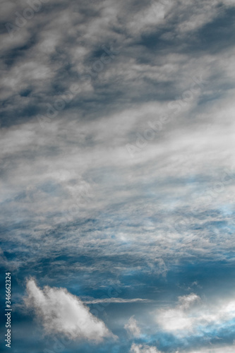 Blue sky in the clouds. Background. Vertical photo in good quality.