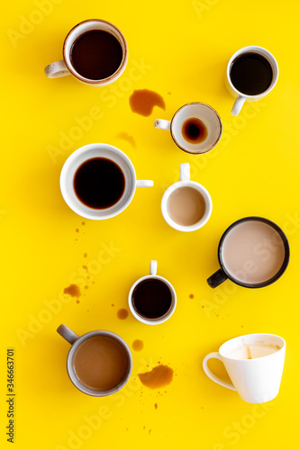 Lots of coffee on yellow background from above