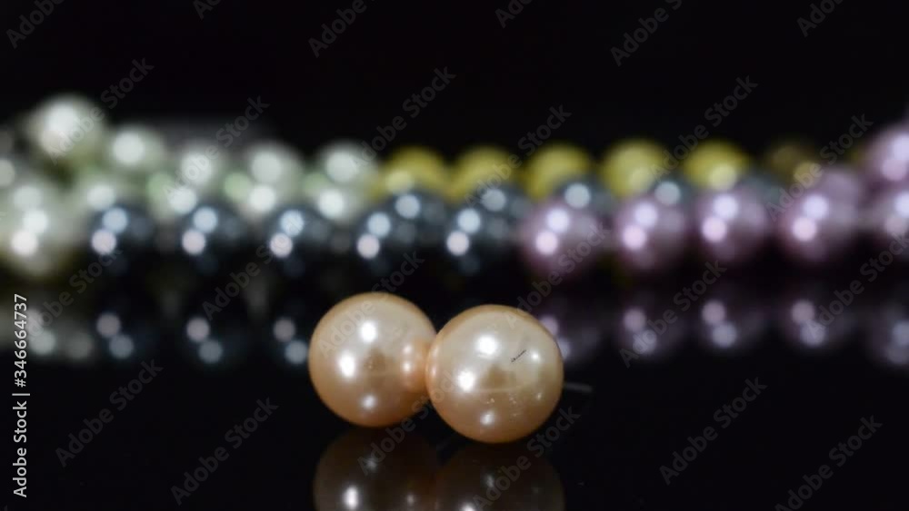 Real pearls Selected, beautiful color, laying on the ground, with reflection Real pearls Selected, beautiful color, laying on the ground, with reflection