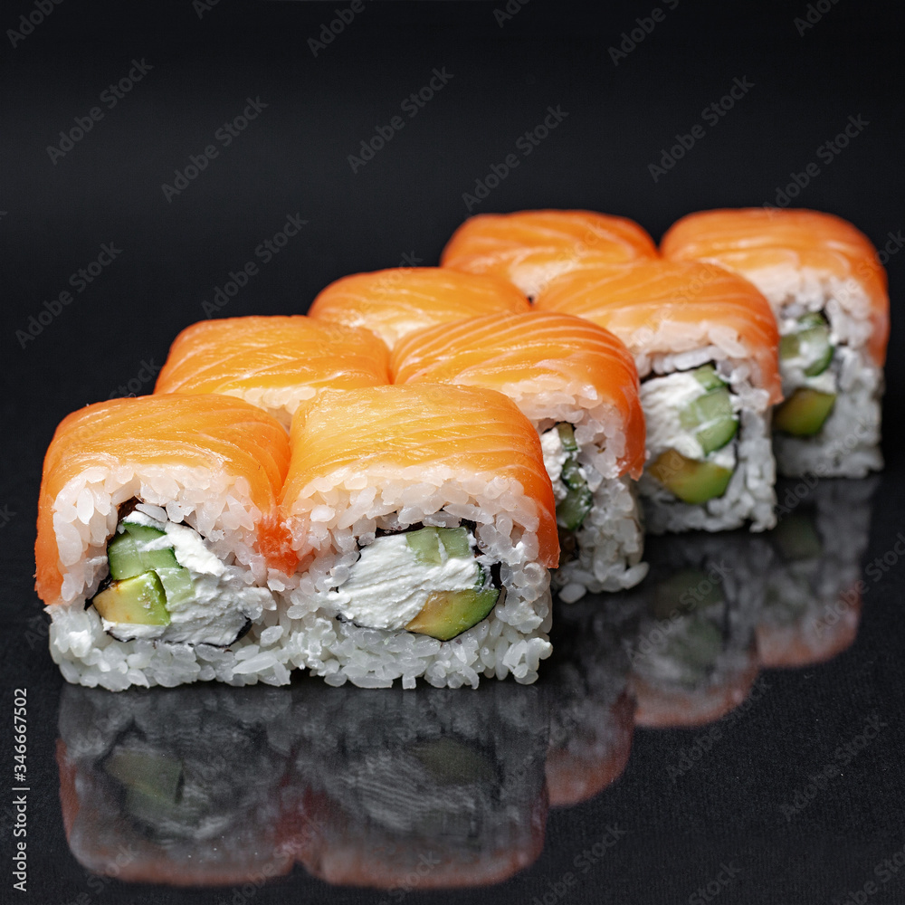 diverse delicious sushi roll set on a black background with reflection, menu diverse delicious sushi roll set on a black background with reflection, menu