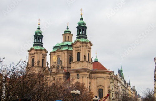 Photography Low angle shot of the Saint Nicholas Church in Prague, Czechia with a gloomy sky