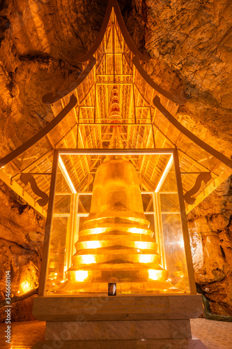 Phra Sabai cave with golden pagoda in Lampang province photo