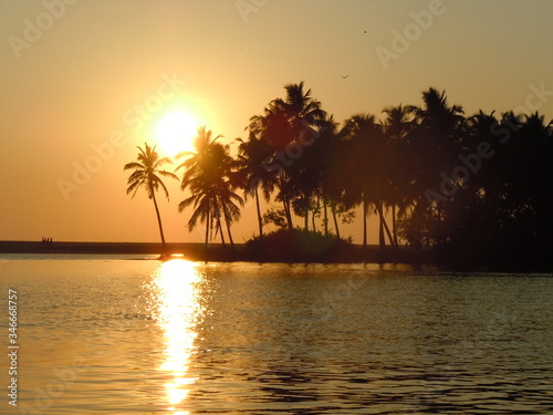Scenic View Of Calm Sea At Sunset