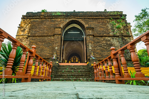 Ancient pagoda in Chet Yod temple photo