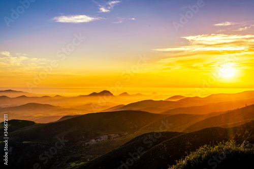Sunset from View over Silhouetted Mountains 