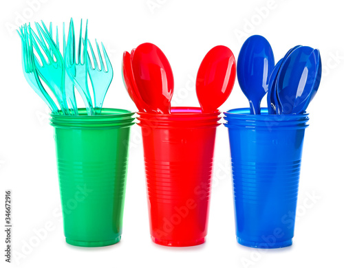 Set of plastic tableware on white background