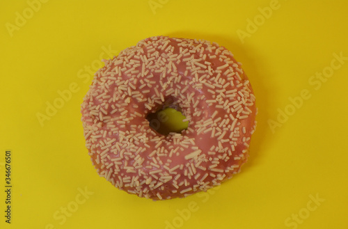 Delicious glazed donut on a bright background.