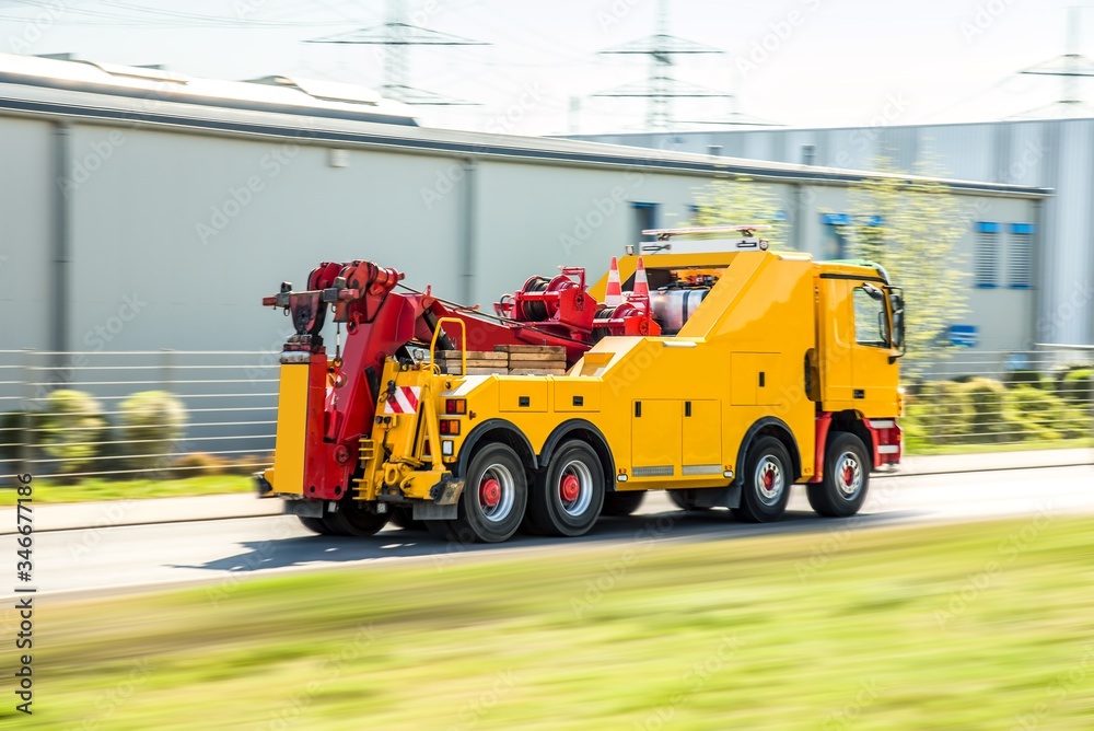 Road Assistance Service. yellow tow truck . transport of evacuation of cars