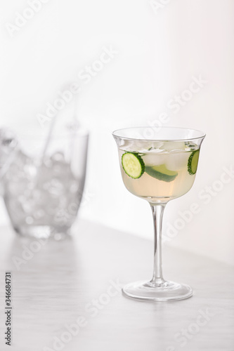 Glass of tasty cucumber martini on table