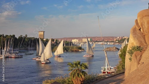 Beautiful landscape with felucca boats on Nile river in Aswan at sunset, Egypt, 4k