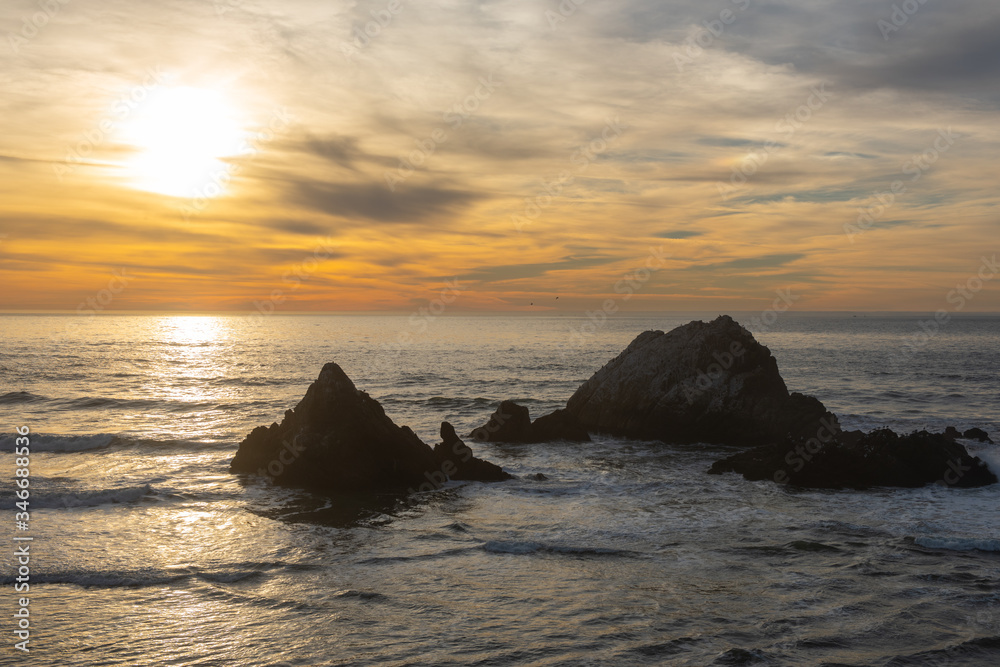Ocean Beach at dusk with the Seal Rock in San Francisco, California