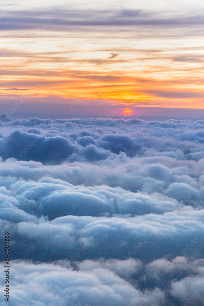 Beautiful clouds view from The Cosmiques Hut, Aiguille du Midi in the evening light, Chamonix-Mont-Blanc, France