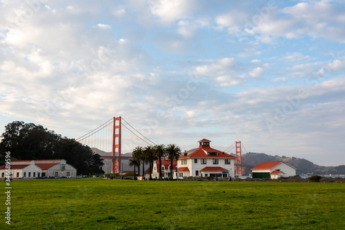 View to the Golden Gate Bridge from Crissy Field Park. White houses with red roof