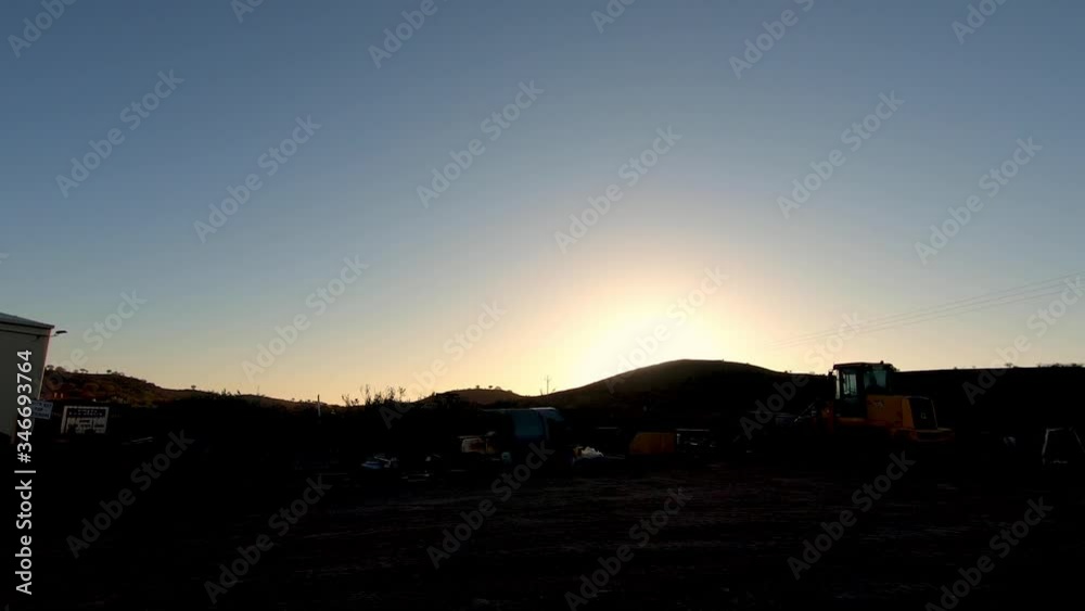 custom made wallpaper toronto digitalSunrise silhouetted over an outback mine site