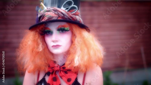 4k Woman Dressed up as Madhatter Posing Sad photo