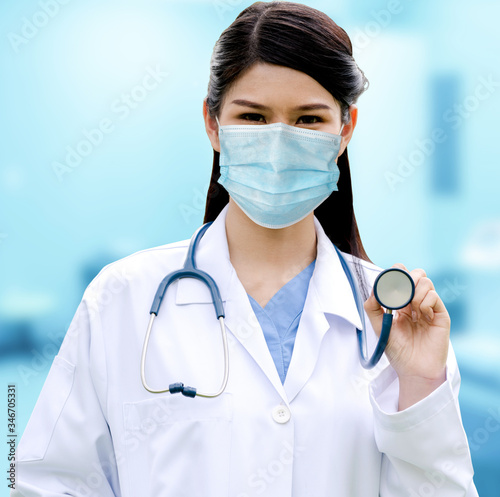 Doctor wear face mask in hospital protect from coronavirus disease or COVID-19. Medical staff are high risk people to receive infection from coronavirus disease or COVID-19. photo