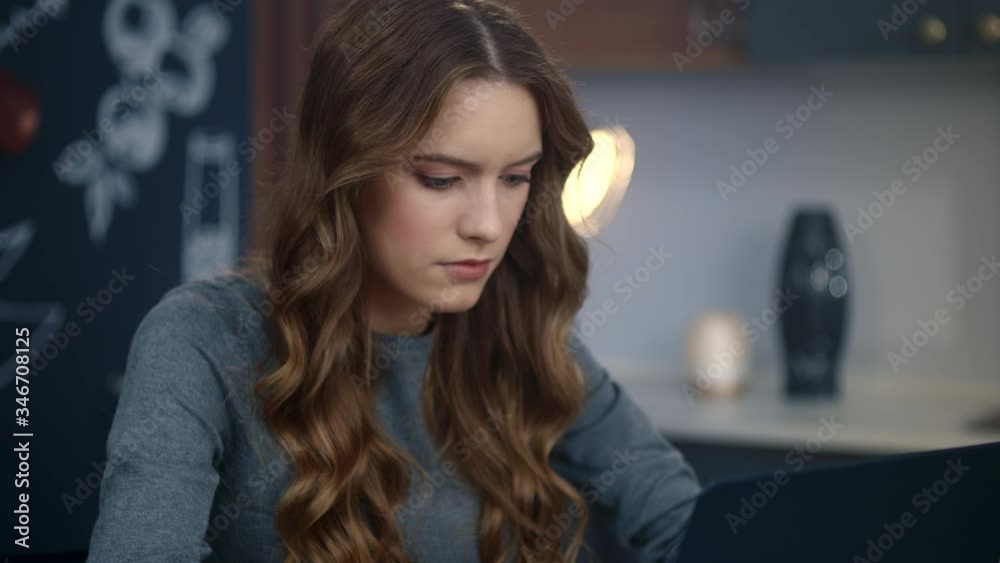 Businesswoman getting bad news on computer at home. Upset girl typing laptop Businesswoman getting bad news on computer at home. Upset girl typing laptop