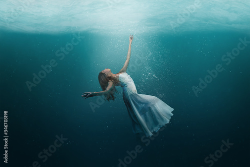 Dancer underwater in a state of peaceful levitation