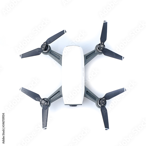 Closeup modern white Dron helicopter with a full HD camera, A Professional Quadcopter isolated on white background, overlight 
