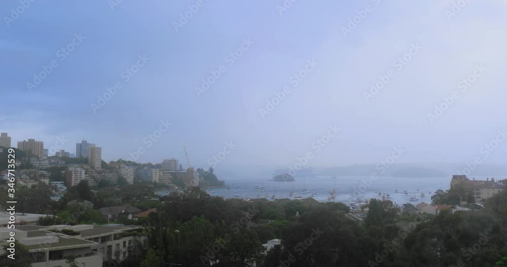 Approaching storm. Time lapse of an approaching rain shower over Double Bay, Sydney, Australia. The rain hits the camera lens. Approaching storm. Time lapse of an approaching rain shower over Double Bay, Sydney, Australia. The rain hits the camera lens.
