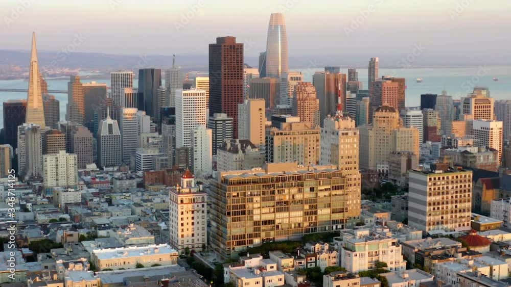 San Francisco city, Aerial, tilt up, drone shot of office buildings and skyscrapers in downtown, during sunrise, in California, United states San Francisco city, Aerial, tilt up, drone shot of office buildings and skyscrapers in downtown, during sunrise, in California, United states