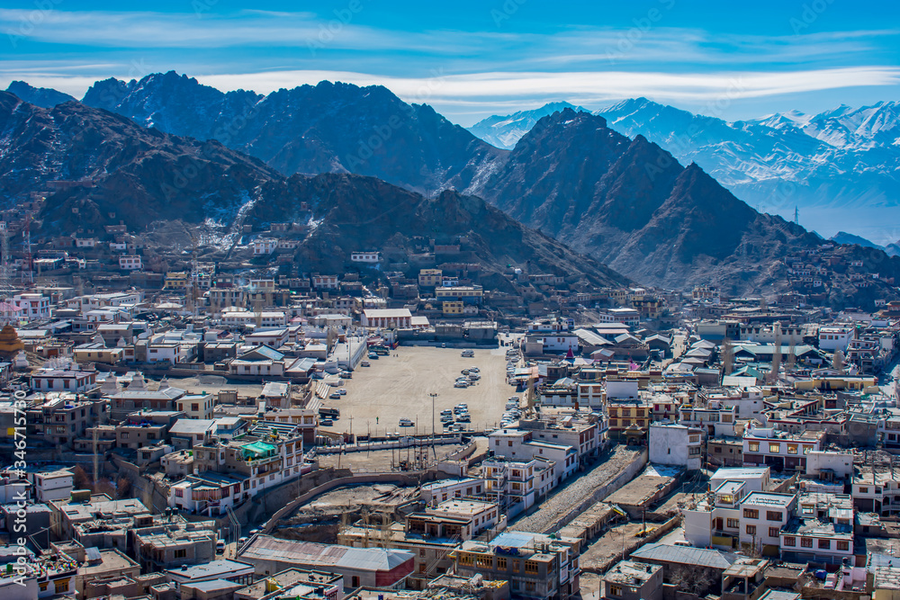 View of Leh City from Mountain top with the Himalayan mountain at back, photo captured in the winter season