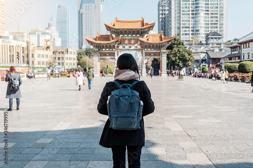 Fényképezés Young woman traveler traveling at Jinbi square, golden Horse and Jade Rooster Archways