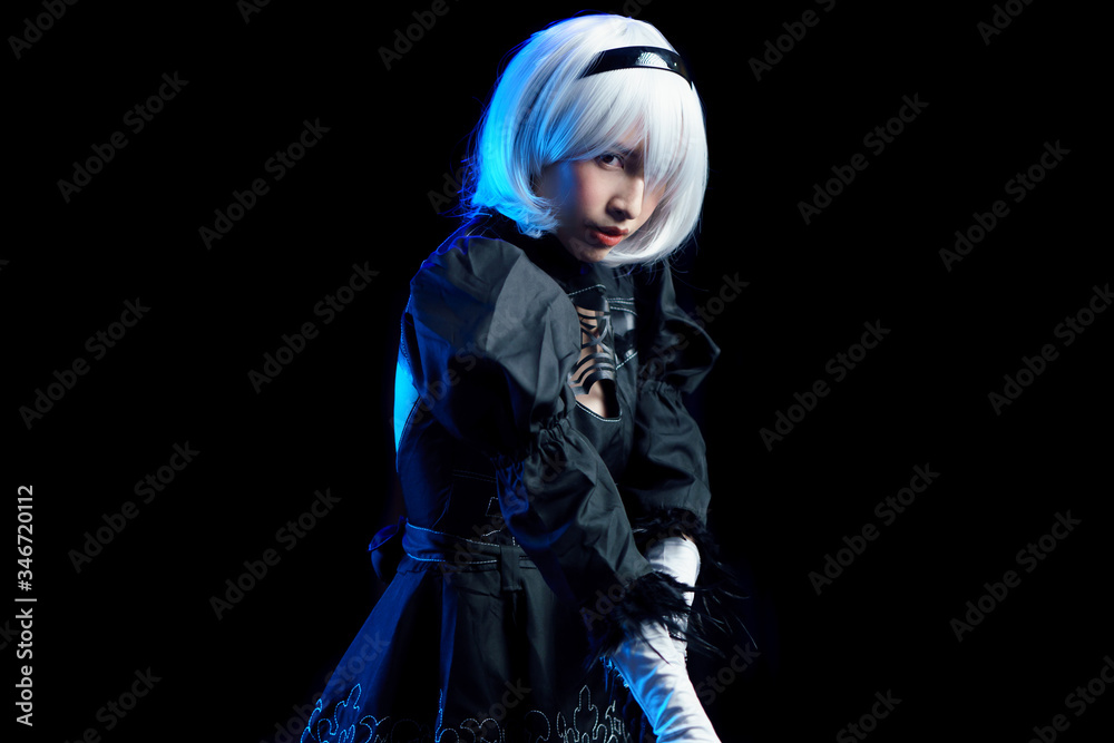 Naklejka premium Japan anime cosplay. portrait of woman in black dress with white hair.