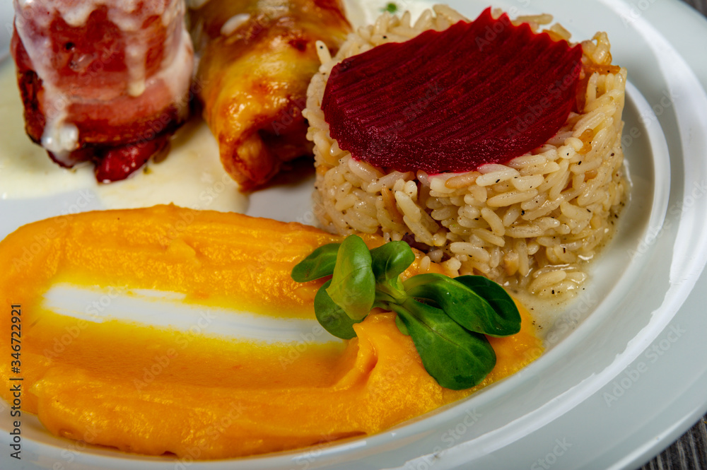 lunch with meat roll with vegetables and sauces and beets